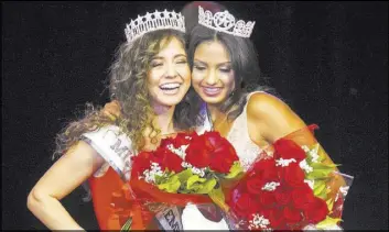  ??  ?? Miss El Tiempo Miranda Contreras, left, and Miss Teen El Tiempo Noelani Mendoza hug onstage at the Miss El Tiempo pageant.