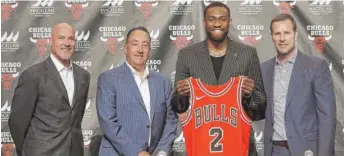  ?? GETTY IMAGES (ABOVE), AP ?? Jabari Parker (playing defense with the Bucks last season against the Celtics’ Marcus Morris, above) officially was introduced as a member of the Bulls on Wednesday.