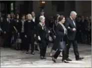  ?? KATHY KMONICEK — THE ASSOCIATED PRESS ?? Family members, including Franklin Graham, right, walk to vehicles before the body of Rev. Billy Graham leaves the Billy Graham Training Center at the Cove on Saturday in Asheville, N.C.