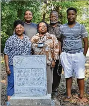  ?? CONTRIBUTE­D ?? Pfc. Penia Roberts’ relatives visit his grave at Roberts Chapel United Methodist Church in Concord. Great-greatniece Susan Hines-Chaney (center) is pleased a plaque in Griffin honors him and other WWI vets.