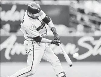  ?? FRANK GUNN THE CANADIAN PRESS ?? Minnesota Twins catcher Mitch Garver hits a two-run double during 11th-inning American League baseball action against the Blue Jays in Toronto on Wednesday. The Twins won, 12-6, for a three-game sweep.