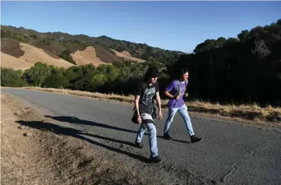  ?? JOSE CARLOS FAJARDO/STAFF ?? San Ramon teens Mathieu Doring and Aidan Jenkins hike along the Rocky Ridge View Trail at the Las Trampas Wilderness Regional Preserve in San Ramon.