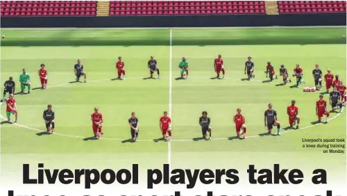  ??  ?? Liverpool’s squad took a knee during training on Monday.