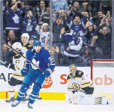  ?? STEVE RUSSELL TORONTO STAR ?? Fans at Scotiabank Arena celebrate after Josh Leivo scores for the Maple Leafs on Monday night. Travis Dermott, Zach Hyman and Igor Ozhiganov also scored as the Leafs defeated the Bruins 4-2 . More coverage including Game Centre, S2.