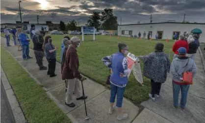  ??  ?? Voters got up with the sun to line up outside the voter registrar’s office in Roanoke, Virginia. Photograph: Don Petersen/AP