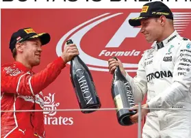  ??  ?? Bottoms up: Bottas (right) shares podium with Vettel in Spielberg