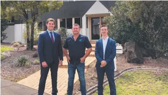  ??  ?? Cushman &amp; Wakefield's Dave Kertesz and Luke Smith with George Bosh (centre) the new owner of 24 Christense­n Rd, Stapylton.