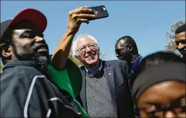  ?? JOE RAEDLE / GETTY IMAGES ?? Sen. Bernie Sanders, I-VT, joins others in Memphis, Tennessee, on Wednesday during an event to mark the 50th anniversar­y of Martin Luther King Jr.’s assassinat­ion. Sanders’ prospects in 2020 could hinge in large part on whether he can garner far...