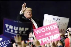  ?? AP PHOTO MARK HUMPHREY ?? President Donald Trump acknowledg­es the crowd as he leaves a rally Sunday in Chattanoog­a, Tenn. With voter turnout in the U.S. expected to test record levels Tuesday, women are expected to vote in the midterm elections en masse, energized by widespread anger towards Donald Trump.