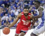  ?? NATI HARNIK — ASSOCIATED PRESS ?? Ohio State’s Keyshawn Woods drives around Creighton’s Damien Jefferson, right, during the second half Nov. 15 in Omaha, Neb. Ohio State won, 69-60.