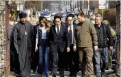  ?? IORI SAGISAWA / KYODO NEWS VIA ASSOCIATED PRESS ?? Japanese Prime Minister Fumio Kishida (center) arrives at a church in Bucha, outside Kyiv, Ukraine, on Tuesday.