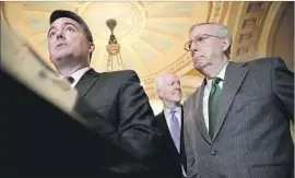 ?? Chip Somodevill­a Getty Images ?? REPUBLICAN Sens. Cory Gardner, left, and Mitch McConnell, the majority leader, right, are among those in the party urging Moore to end his candidacy.