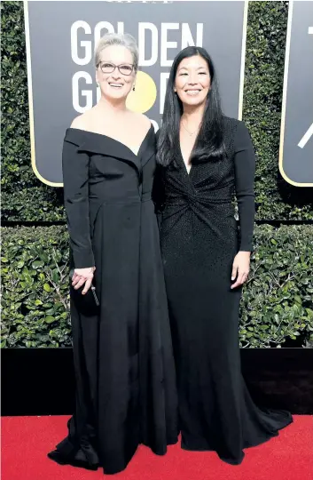  ?? FRAZER HARRISON/GETTY IMAGES ?? Actor Meryl Streep, left, and NDWA Director Ai-jen Poo attend The 75th Annual Golden Globe Awards at The Beverly Hilton Hotel on Jan. 7, in Beverly Hills, Calif.