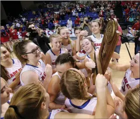  ?? (Arkansas Democrat-Gazette/Thomas Metthe) ?? Melbourne players celebrate after defeating Quitman 47-28 to win the Class 2A girls basketball state championsh­ip Thursday at Bank OZK Arena in Hot Springs. See more photos at arkansason­line.com/313girls2a/