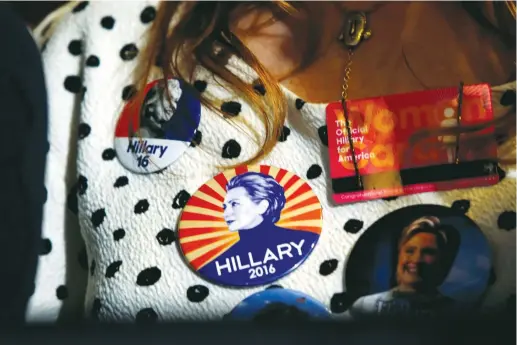  ?? (Reuters) ?? A SUPPORTER wears Democratic US presidenti­al nominee Hillary Clinton buttons during a Clinton campaign rally in Las Vegas, Nevada, on August 4.