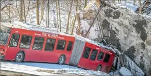  ?? Pittsburgh Post-Gazette ?? A Port Authority bus in the wreckage of the collapsed Fern Hollow Bridge.