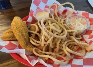  ?? (Arkansas Democrat-Gazette/Eric E. Harrison) ?? Catfish platter with add-on onion rings at Hubcap Burger Co. on Cantrell Road was the big surprise.