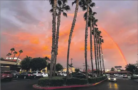  ?? Raul Roa Los Angeles Times ?? A RAINBOW forms over Whittier after a Sept. 11 shower. The moisture was not enough to rehydrate plants, climate and fire experts say.