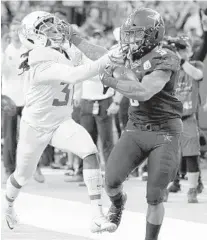  ?? MICHAEL WYKE/AP ?? Vanderbilt running back Ke’Shawn Vaughn, right, rushed for 243 yards and two touchdowns on just 13 carries in the Texas Bowl.