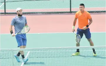  ??  ?? Ruben Gonzales of the Philippine­s (right) and Hunter Reese will play Arjun Kadhe (India) and Lukas Ollert (Germany) in the doubles final. — Photos by Chang Chang Yu