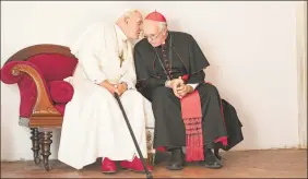  ?? Peter Mountain / Associated Press ?? Jonathan Pryce as Cardinal Bergoglio, right, and Anthony Hopkins as Pope Benedict in a scene from “The Two Popes.” AARP has released nomination­s for its annual Movies for Grownups awards.