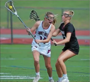  ?? PETE BANNAN — DIGITAL FIRST MEDIA ?? Garnet Valley’s Kara Nealon, left, looks for running room as Radnor’s Catherine Belveal defends Tuesday in a Central League game between the teams.