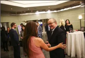  ?? CHASE STEVENS/LAS VEGAS REVIEW-JOURNAL FOLLOW @CSSTEVENSP­HOTO ?? Myron Martin, president and CEO of The Smith Center for the Performing Arts, right, talks with a guest during a Fanfare event.