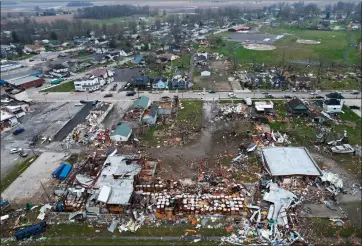  ?? JOSHUA A. BICKEL — THE ASSOCIATED PRESS ?? Debris scatters the ground following a severe storm Friday in Lakeview, Ohio.