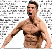  ?? AFP ?? Muscling in: Ronaldo strips to celebrate his winner