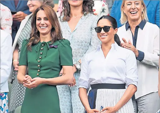  ??  ?? The Duchess of Cambridge, left, and The Duchess of Sussex watch the ladies’ singles final between Serena Williams and Simona Halep yesterday