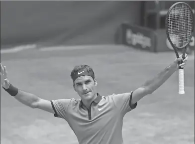  ?? Associated Press ?? Another win: Switzerlan­d's Roger Federer celebrates after beating Germany's Florian Mayer in the quarterfin­al of the ATP tournament in Halle, Germany, Friday.