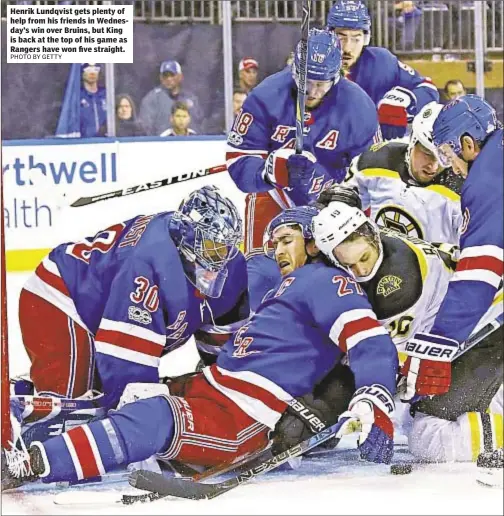  ??  ?? Henrik Lundqvist gets plenty of help from his friends in Wednesday’s win over Bruins, but King is back at the top of his game as Rangers have won five straight.