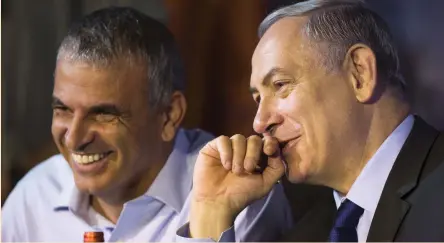  ??  ?? FINANCE MINISTER Moshe Kahlon and Prime Minister Benjamin Netanyahu smile during a signing ceremony for housing units in Ashkelon, in this file photo from October 2015.