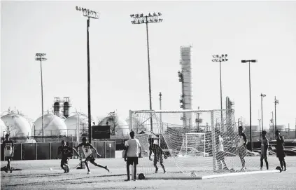  ?? Kim Brent / Staff photograph­er ?? Port Neches-Groves High School students play soccer at the practice field that just days prior crews combed for debris.