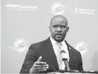  ?? BRYNN ANDERSON/AP ?? New Miami Dolphins coach Brian Flores took time out Friday to participat­e in a charity golf event that raises money for cancer research.