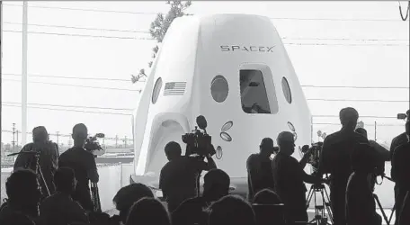  ?? Genaro Molina Los Angeles Times ?? SPACEX shows a mock-up of the Crew Dragon astronaut transport capsule in Hawthorne. The first voyage is scheduled for November.