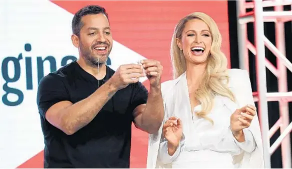  ?? DAVID LIVINGSTON/GETTY ?? Magician David Blaine enlisted the aid of former reality TV star Paris Hilton during a YouTube panel.