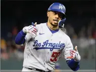  ?? NICK WASS — THE ASSOCIATED PRESS ?? The Dodgers' Mookie Betts celebrates one of his two home runs against the Washington Nationals on Tuesday in Washington.