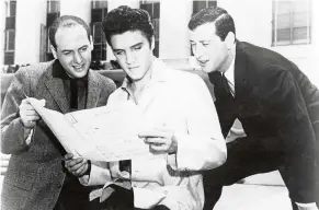  ?? — Filepic ?? Stoller (left) is seen here with Elvis Presley (centre) and songwriter Leiber in this 1957 file photo. Stoller and Leiber co-wrote Stand By Me, which was recently performed at the Royal Wedding.