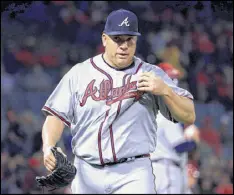  ?? HARRY HOW / GETTY IMAGES ?? Bartolo Colon, at 44 the oldest player in the majors, also has the highest ERA (6.99) of any qualified starter. He lasted just 2⅓ innings Tuesday night against the Angels, but he was hurt by poor fielding.