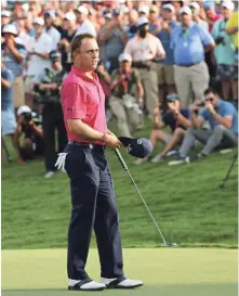  ?? ROB SCHUMACHER, USA TODAY SPORTS ?? The crowd cheers Justin Thomas after he made his final putt to cap his PGA Championsh­ip victory Sunday.