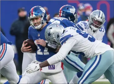  ?? RICH HUNDLEY III — FOR THE TRENTONIAN ?? Giants quarterbac­k Jake Fromm (17) is sacked by Dallas Cowboys defensive lineman Tarell Basham (98) during Sunday’s NFL game at MetLife Stadium in East Rutherford.
