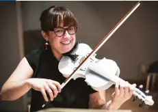  ?? ?? LEFT Concert violinist Mary-Elizabeth Brown shows off one of her 3D-printed creations