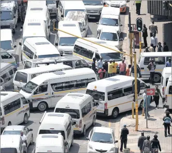  ?? PHOTO: DUMISANI SIBEKO ?? Taxi strike members blockade a street in Johannesbu­rg. A planned protest tomorrow has been called off after an agreement being reached between the involved parties.