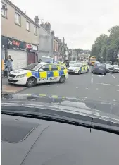  ??  ?? Rapid response Police attend scene of last month’s armed robbery in Green Street