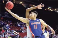  ?? Andy Lyons / TNS ?? University of Florida forward Keyontae Johnson, seen here in a 2019 game, was hospitaliz­ed in critical but stable condition after collapsing on court in a game against Florida State on Saturday.