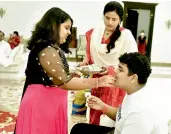  ??  ?? Alekya, daughter of IT and Industries Minister K.T. Rama Rao, offers sweets to her brother Himanshu after tying rakhi to celebrate Raksha Bandhan on Monday.