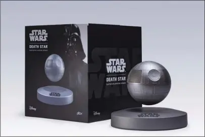  ?? The Associated Press ?? USING THE FORCE: This photo provided by Plox shows the “Star Wars” Death Star levitating bluetooth speaker. It’s a little tricky to set up, but once you get the Death Star positioned correctly over its base, it floats in the air thanks to well-placed...