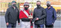  ?? STEPHANIE MITCHELL/RED SHORES ?? David Dowling won the Paul MacDonald Memorial Driving Championsh­ip Saturday at Red Shores at the Charlottet­own Driving Park. From left are Prince Edward Island Standardbr­ed Horse Owners Associatio­n president Peter Smith, Dowling, Danny and Devon MacDonald, who are Paul MacDonald’s son and grandson, respective­ly.