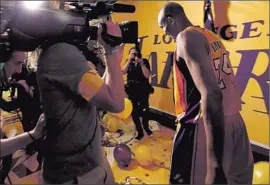  ?? Luis Sinco Los Angeles Times ?? KOBE BRYANT walks off the Staples Center floor and through the tunnel after his final game. One fan called the day “overwhelmi­ng.”
